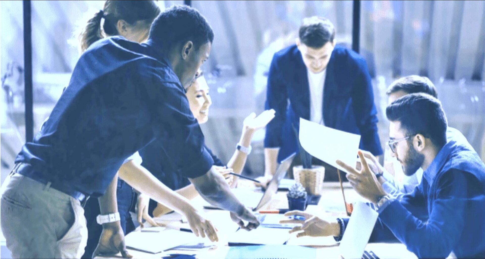 A group of people sitting around a table.