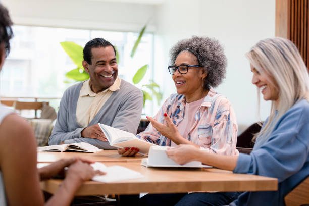 A group of people sitting around a table.