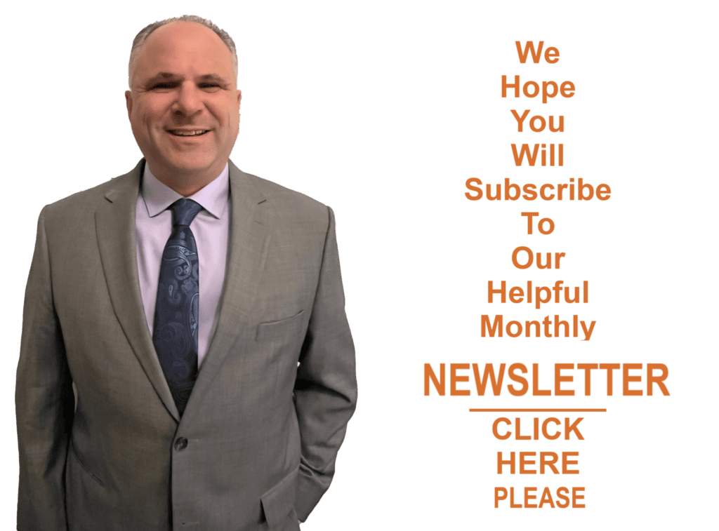 A man in a suit and tie standing next to an orange text.